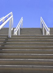 Concrete steps climbing up to the blue sky