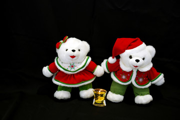 Christmas bears with candle on dark background