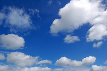 Naklejka na ściany i meble A summer sky with white clouds.