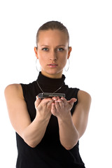 Naklejka premium Serious girl holding mobile phone