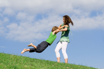 fun outdoors, happy young mother and child