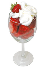 Strawberries and whipped cream in glass. Clipping path.