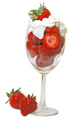 Strawberries and whipped cream in glass. Clipping path.