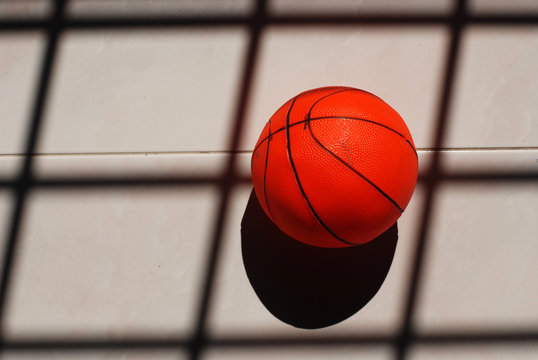 basket ball and shadow on the floor