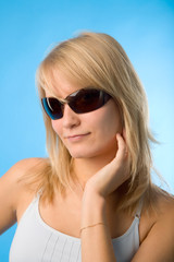 Naklejka premium the portrait of young woman on blue background