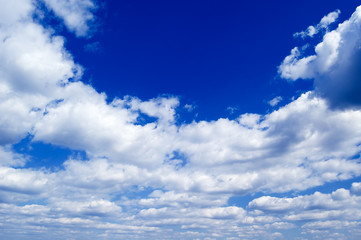 The beautiful white clouds on background blue sky.