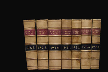 Spines of law reports against a black background