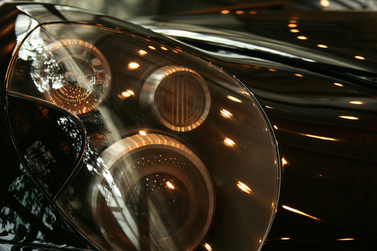 Headlamp on black sports car