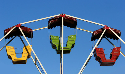 The top part of a ferris wheel at a fair