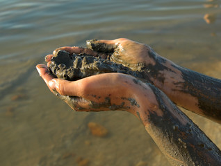 half naked woman add dead sea clay 