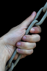 image of hand holding chains