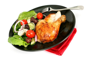 Meal of roast chicken and greek salad