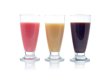 Three milkshakes  reflected on white background