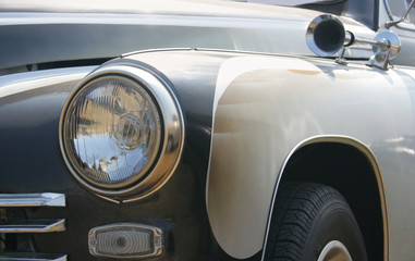 Classic and vintage cars - headlight and klaxon close-up 1950s