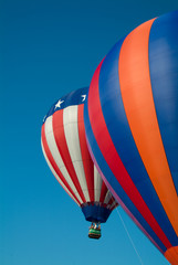 Obraz premium Hot Air Balloonsw ascending into a clear blue vermont sky