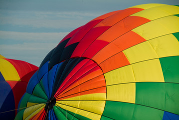 Fototapeta premium Colorful Hot Air Balloons being filled and inflated for flight