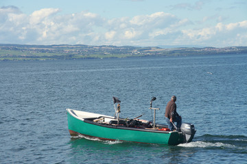 Pecheur sur le lac Leman