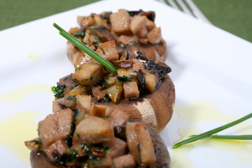 mushrooms filled with garlic sauce and fresh onions