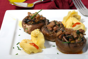 mushrooms filled with garlic sauce and fresh onions