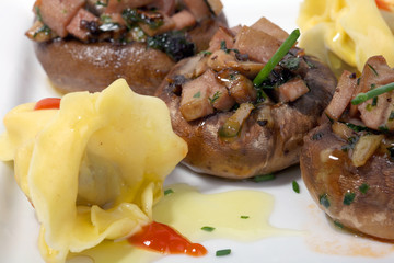 mushrooms filled with garlic sauce and fresh onions