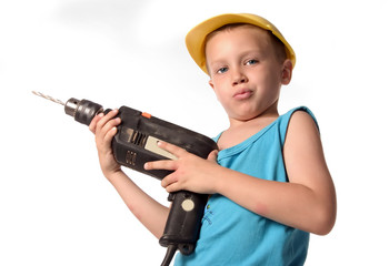 a boy is drilling the wall