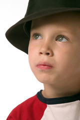a boy is wearing a black hat