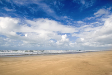 Sunny beach blue sky and golden sand
