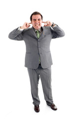 A businessman covering his ears with his fingers