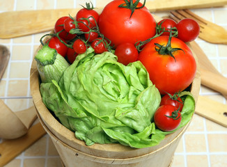 diferents fresh vegetables on wooden basket with drops