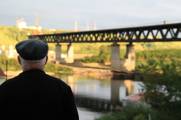 man admiring the future river bridge