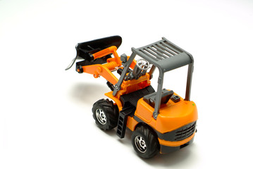 Small model bulldozer on white