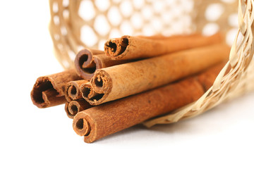 the cinnamon in basket on white