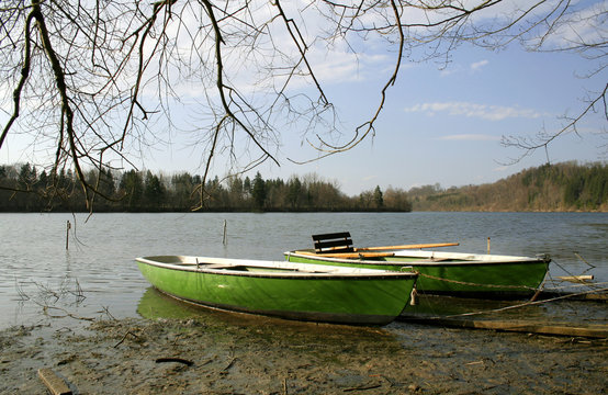 small boats by river bank