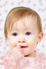 Little Girl with finger in her mouth, taken closeup