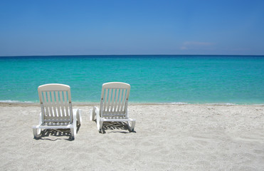 beach chairs on sand 