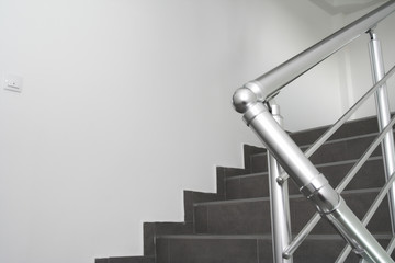 Modern metal staircase bars in an office building