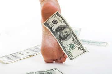 American dollars under foot. Business and easy money concept