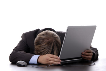 young business man sleeping on the laptop