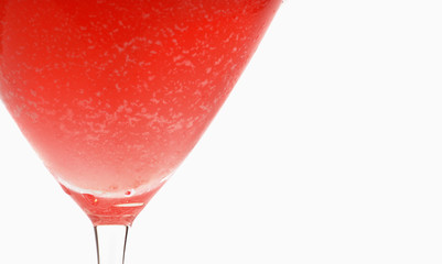 Lower half of a watermelon martini on white