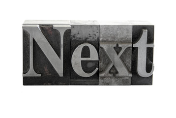 the word 'Next' in old metal letterpress type