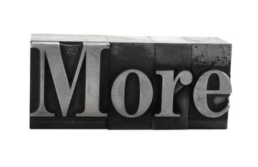 the word 'More' in old, inkstained metal type