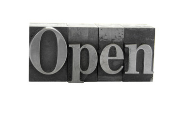 the word 'Open' in old, inkstained metal type
