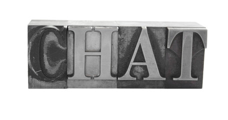 the word 'CHAT' in old, inkstained metal type