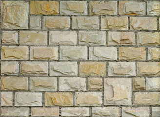 Fragment of new decorative brick wall with stucco