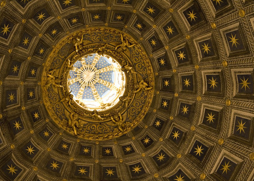 Star patterned ceiling and circular dome of Siena Cathedral.