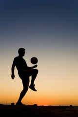 Fototapeta na wymiar football at sunset