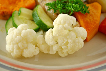 Delicious cauliflower with baked vegetables ready to serve.