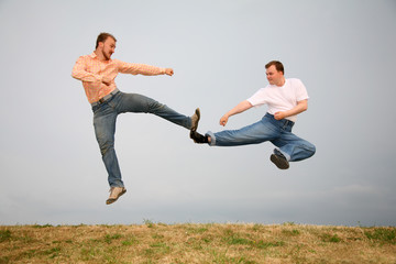 two guys kicking