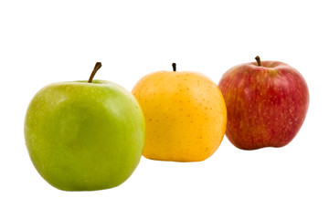 Three fresh apples of different colors on a white background