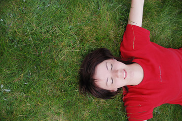 woman laying in grass
